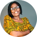 Customer in glasses wearing shoulder-length braids